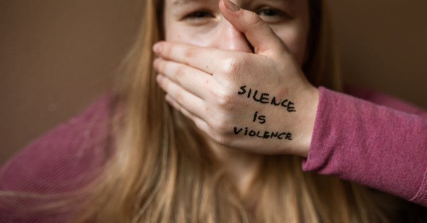 Empathy - Woman in Purple Shirt Covering Her Face With Her Hand