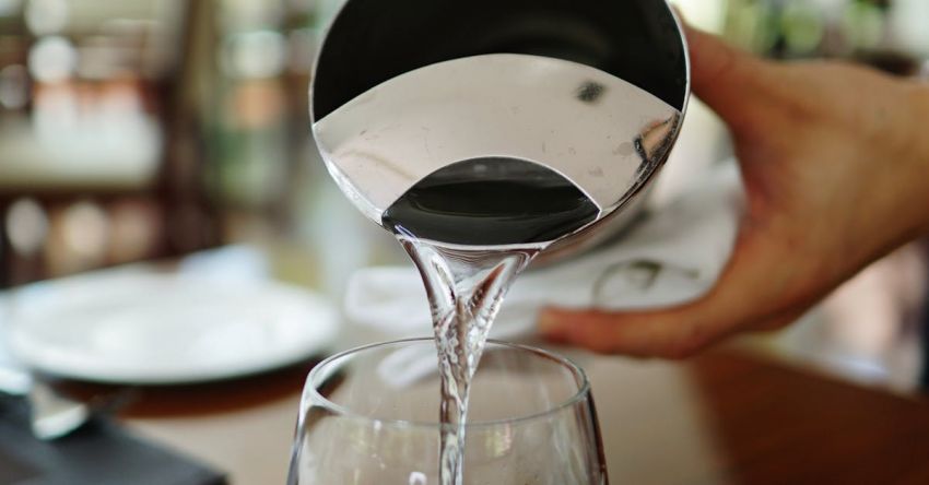 Service - Person Pouring Water on Glass